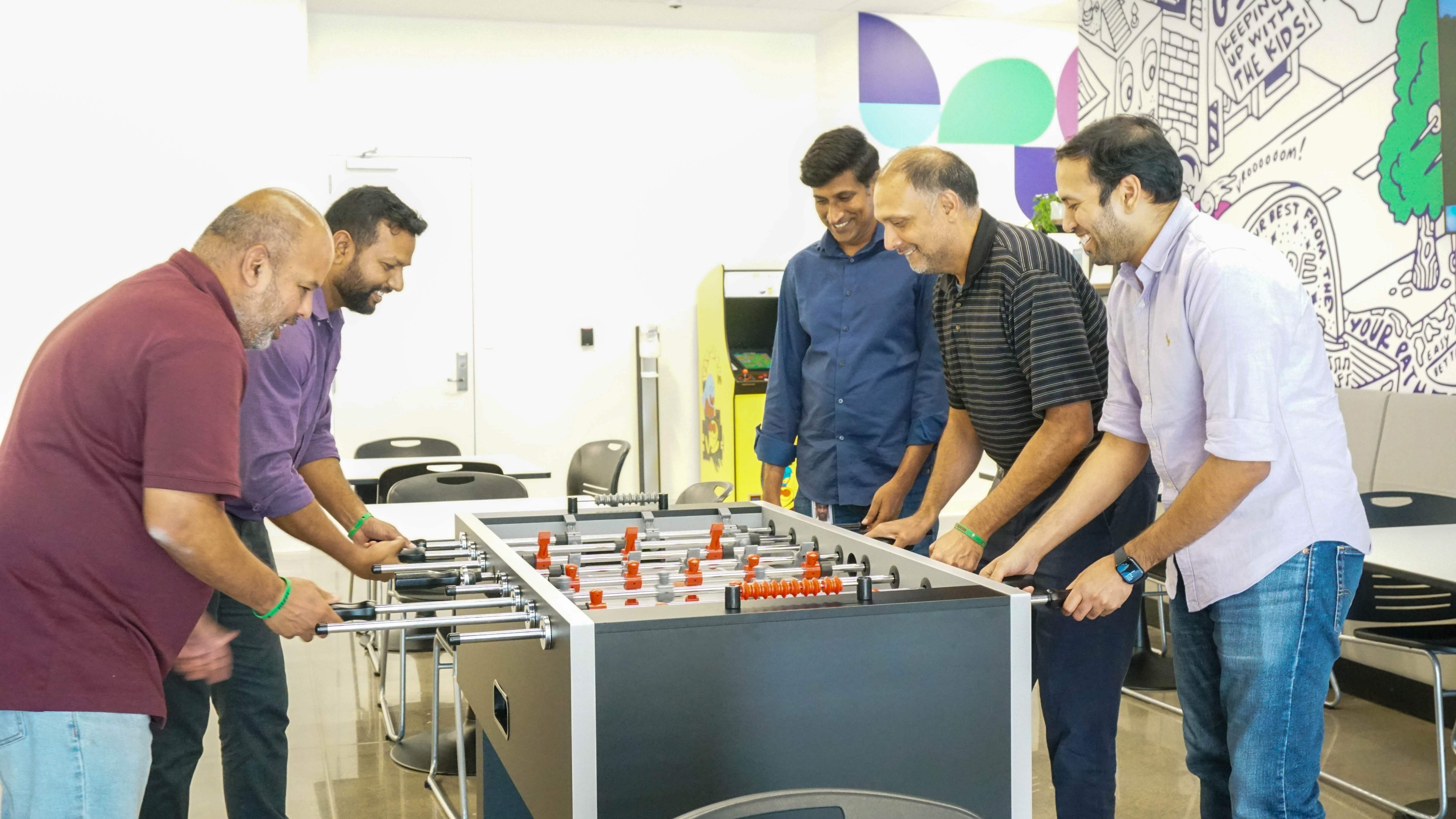 People playing foosball