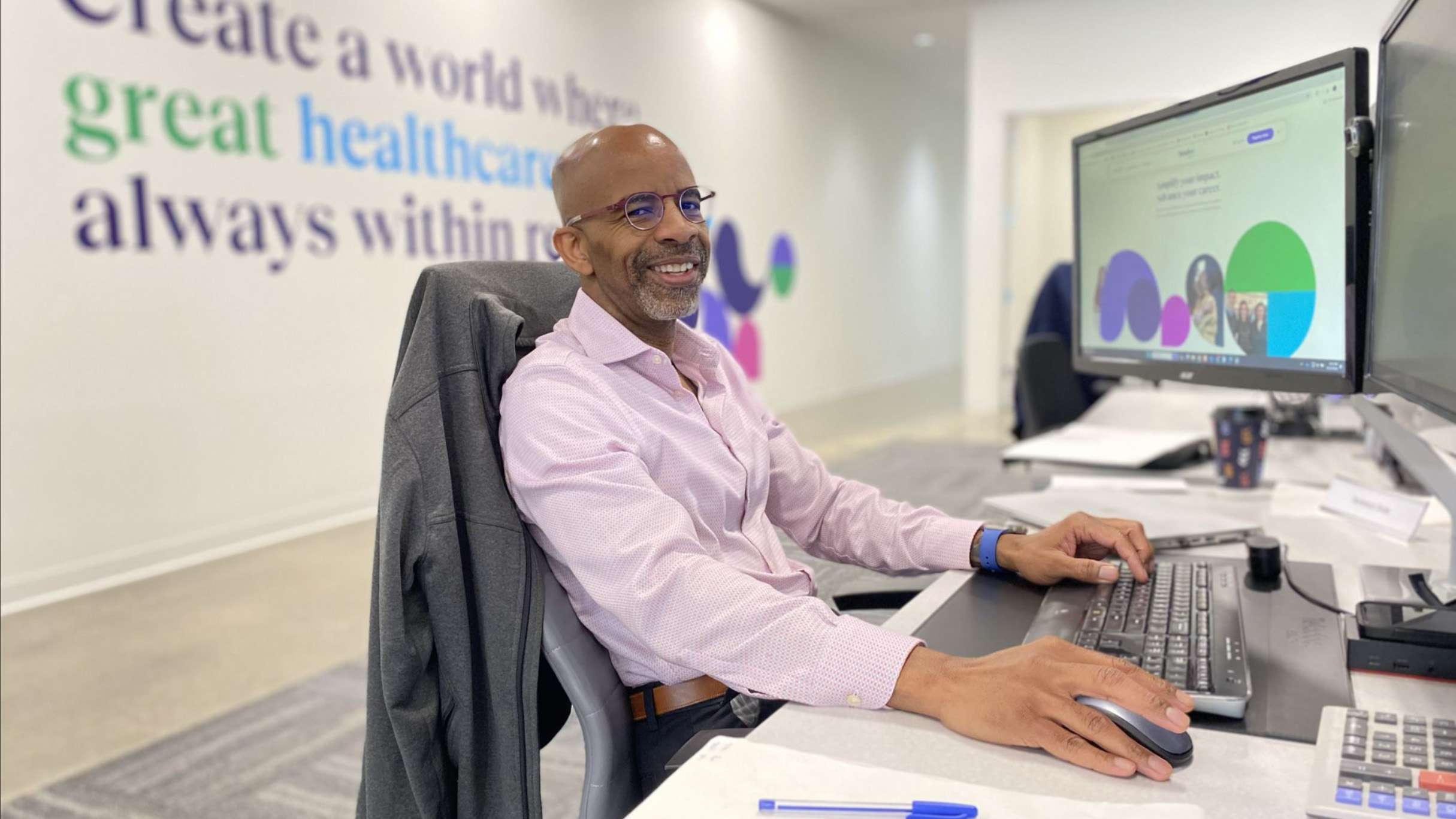 Man sitting at desk working on computer