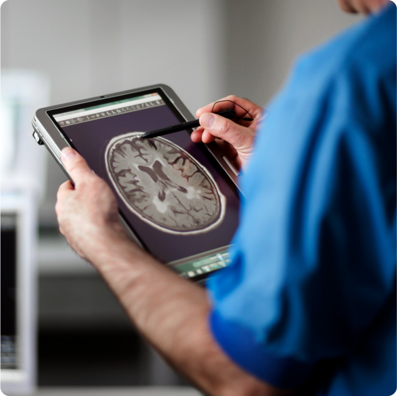 Nurse reviewing a scan on a tablet