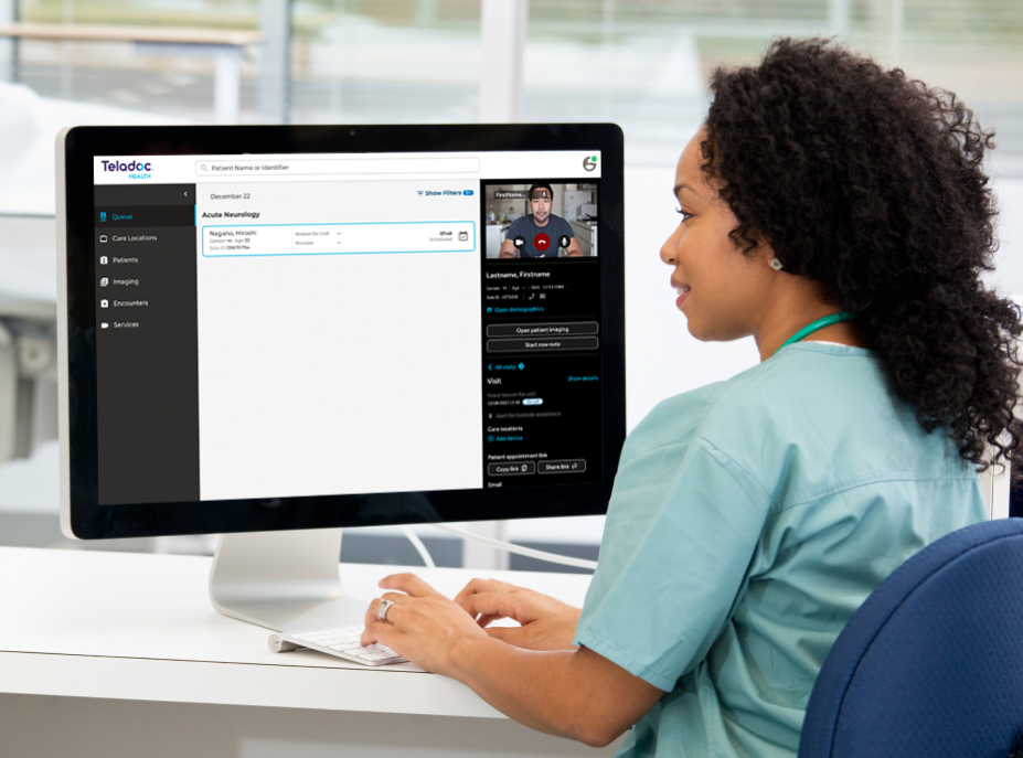 Nurse reviewing data on a computer