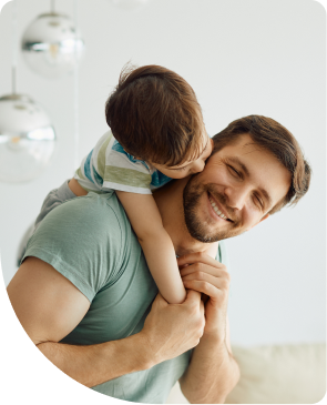 Parent carrying his child on his back