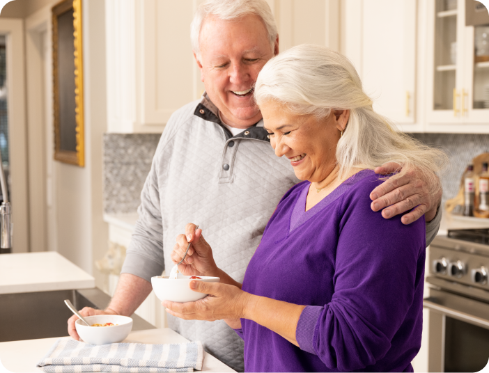 Couple standing in kitchen