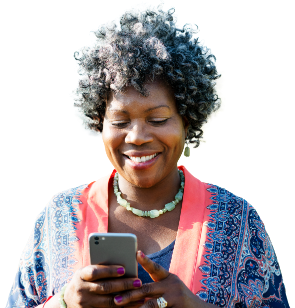 Woman smiling while looking at her phone