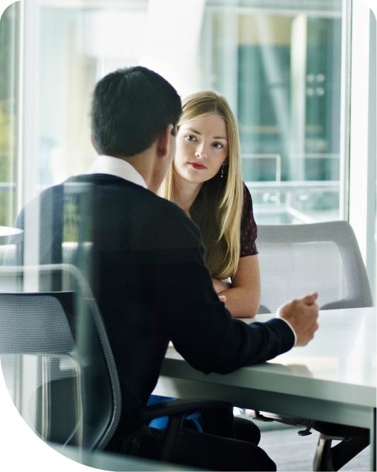 Man and woman talking in an office